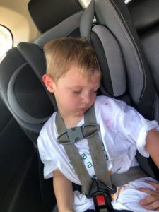 child sleeping in carseat